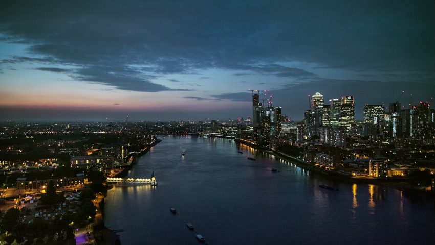 A dusk over a skyline of London with the river Thames.